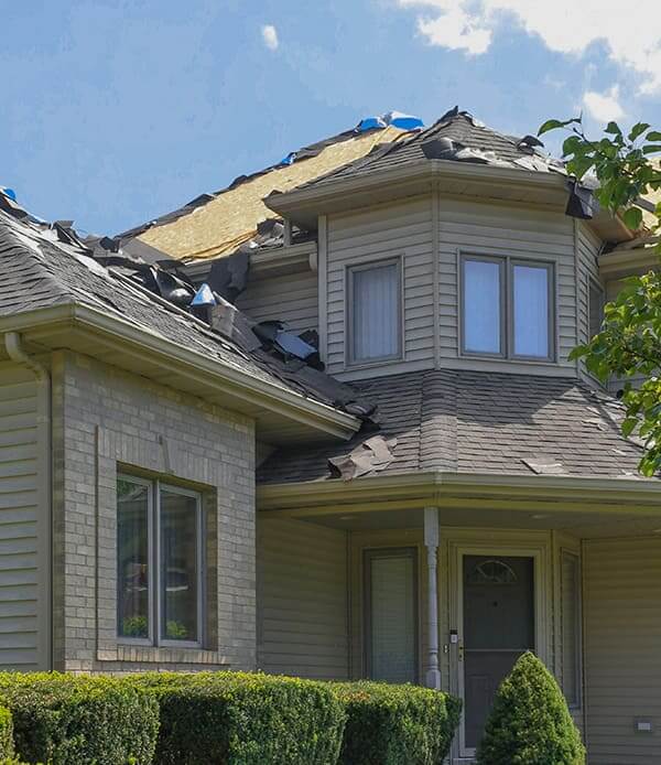 damaged home roof that requires roof replacement