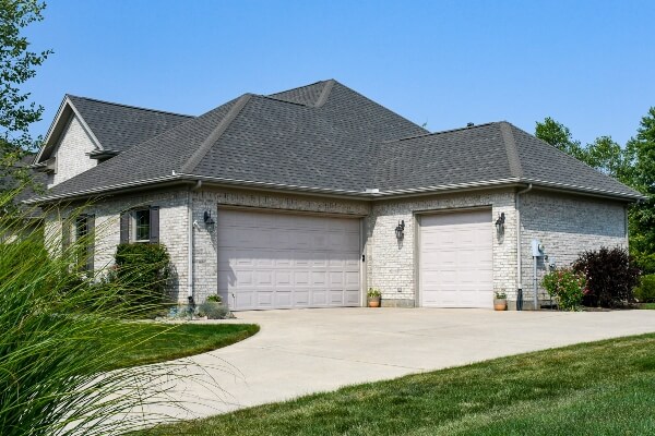 A home can have a wonderful replacement roof put in to look like this gorgeous home, but there are additional challenges when doing the work in the winter.